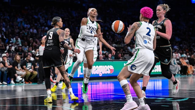 Aug 10, 2025; Brooklyn, New York, USA; Minnesota Lynx guard DiJonai Carrington (3) passes the ball to guard Natisha Hiedeman (2) as New York Liberty guard Natasha Cloud (9) defends during the second half at Barclays Center. Mandatory Credit: John Jones-Imagn Images