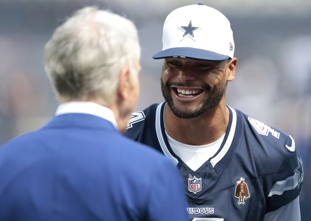 Dak Prescott #4 of the Dallas Cowboys talks with NFL owner Stan Kroenke before the NFL Preseason 2025 game between the Dallas Cowboys and Los Angeles Rams at SoFi Stadium on August 09, 2025 in Inglewood, California.