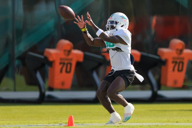 Jul 29, 2025; Miami Gardens, FL, USA; Miami Dolphins wide receiver Tyreek Hill (10) catches the football during training camp at Baptist Health Training Complex. Mandatory Credit: Sam Navarro-Imagn Images/File Photo