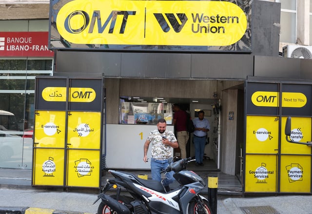 A man leaves OMT Western Union, online money transfer and financial services company branch in Beirut, Lebanon May 28, 2025. REUTERS/Mohamed Azakir/ File Photo