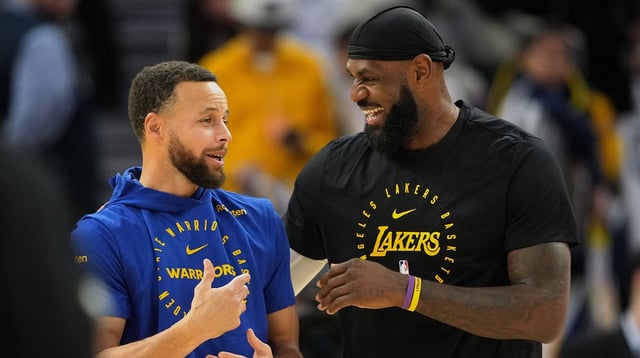 Dec 25, 2024; San Francisco, California, USA; Golden State Warriors guard Stephen Curry (left) and Los Angeles Lakers forward LeBron James (right) talk before the game at Chase Center. Mandatory Credit: Darren Yamashita-Imagn Images