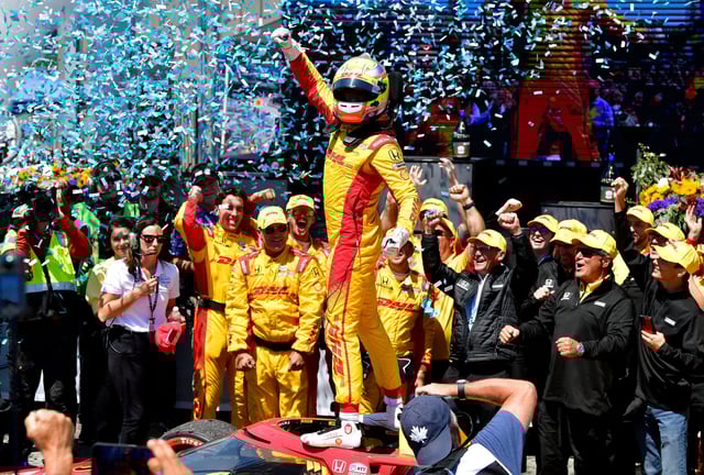 Jul 27, 2025; Salinas, California, USA; Chip Ganassi Racing driver Alex Palou (10) celebrates his victory of the Monterey Grand Prix at WeatherTech Raceway Laguna Seca. Mandatory Credit: Gary A. Vasquez-Imagn Images/File Photo