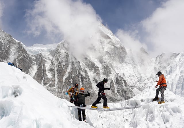 Mountaineers practice walking on a ladder during a training session at Everest base camp, Nepal April 15, 2025. REUTERS/Purnima Shrestha/File Photo