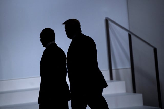 President Vladimir Putin and US President Donald Trump arrive for a group photo at the G20 Summit in Osaka, Japan in 2019.