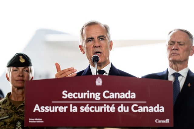 Prime Minister Mark Carney tours Canadian Forces Base (CFB) 8 Wing Trenton in Trenton, Ont., on Friday, Aug. 8, 2025. THE CANADIAN PRESS/Spencer Colby