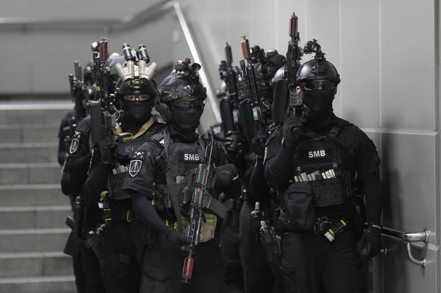 South Korean soldiers get ready to start in an anti-terror drill as a part of the Ulchi Freedom Shield military exercise between the U.S. and South Korea at a subway station in Seoul, South Korea, Tuesday, Aug. 22, 2023.