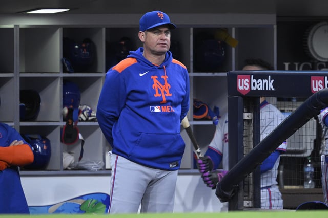 SAN DIEGO, CALIFORNIA - JULY 29: Manager Carlos Mendoza #64 of the New York Mets looks on from the dugout during the fourth inning against the San Diego Padres at Petco Park on July 29, 2025 in San Diego, California.