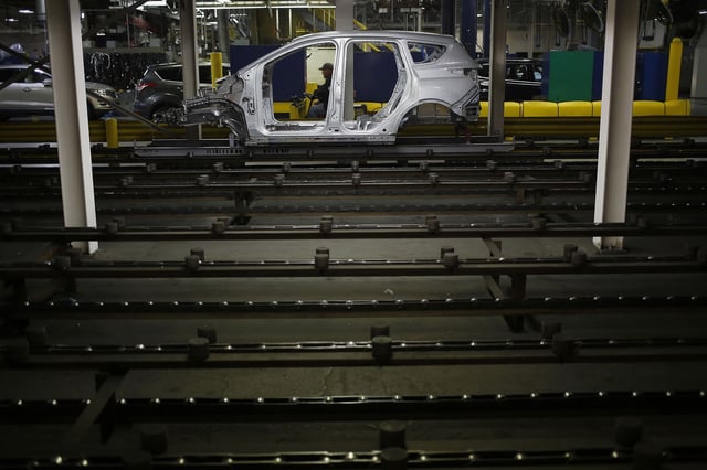 The metal frame of a Ford Escape SUV on the production line at the Ford Louisville Assembly plant in Kentucky. Ford will stop producing the Escape in Louisville, building a new type of assembly line for its next generation of electric vehicles.