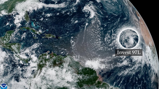 In this weather satellite photo of the eastern Atlantic Ocean taken Monday morning, a label is superimposed to show the location of tropical disturbance Invest 97L off the western coast of North Africa.
