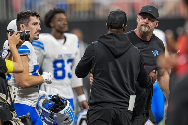 Aug 8, 2025; Atlanta, Georgia, USA; Detroit Lions head coach Dan Campbell and Atlanta Falcons head coach Raheem Morris react after the game was suspended after an injury to Lions safety Morice Norris (26) (not shown) during the game against the Atlanta Falcons at Mercedes-Benz Stadium. Mandatory Credit: Dale Zanine-Imagn Images/File Photo