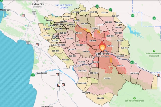 A Watch Duty map shows the approximate location of the blaze along with evacuation orders (red) and warnings (yellow).