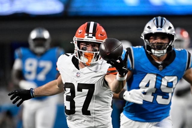 Aug 8, 2025; Charlotte, North Carolina, USA; Cleveland Browns wide receiver Luke Floriea (37) with a fingertip catch as Carolina Panthers linebacker Jon Rhattigan (49) defends in the second quarter at Bank of America Stadium. Mandatory Credit: Bob Donnan-Imagn Images/File Photo