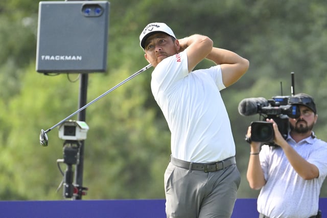 Aug 8, 2025; Memphis, Tennessee, USA; Xander Schauffele plays his shot from the ninth tee during the second round of the FedEx St. Jude Championship golf tournament. Mandatory Credit: Steve Roberts-Imagn Images/File Photo