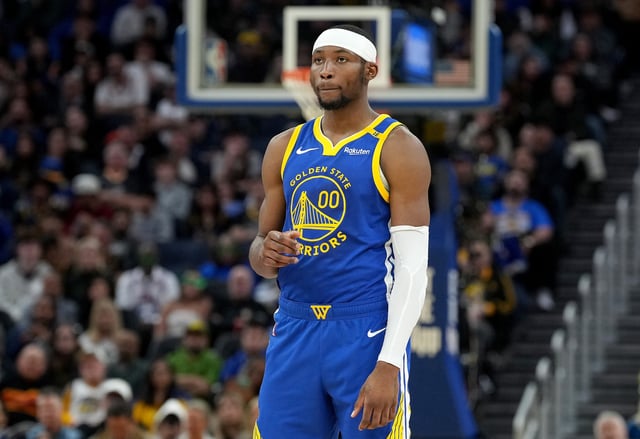 Jonathan Kuminga #00 of the Golden State Warriors looks on against the Denver Nuggets during the second half of an NBA basketball game at Chase Center on March 17, 2025 in San Francisco, California.