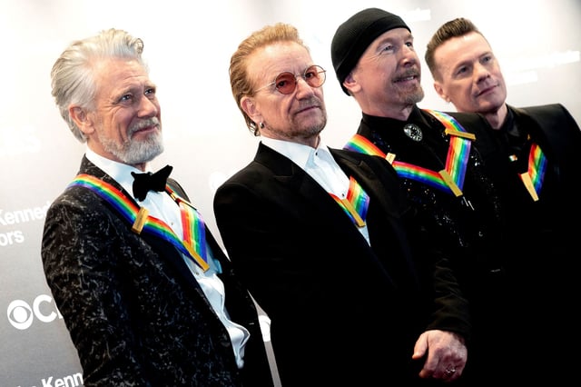 (L-R) Irish musicians Adam Clayton, Bono, Larry Mullen Jr, and The Edge from U2 arrive for the 45th Kennedy Center Honors at the John F. Kennedy Center for the Performing Arts in Washington, DC, on December 4, 2022. (Photo by Stefani Reynolds / AFP) (Photo by STEFANI REYNOLDS/AFP via Getty Images)