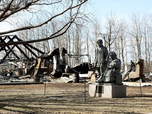 Pioneer Family by Leo Mol sculpture Pioneer Family is surrounded by wildfire damage at the Ukrainian Cultural Heritage Village, in Lamont County east of Edmonton, April 19, 2025. 
