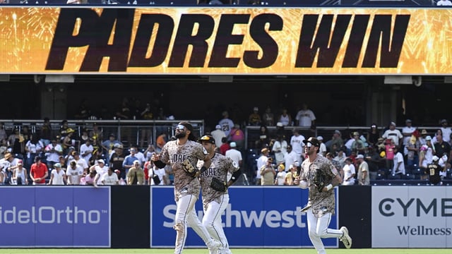 Aug 3, 2025; San Diego, California, USA; San Diego Padres right fielder Fernando Tatis Jr. (23), left, Ramon Laureano (5), center and Jackson Merrill (3) leave the field after the Padres beat the St. Louis Cardinals at Petco Park. Mandatory Credit: Denis Poroy-Imagn Images