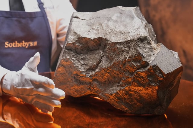 FILE — A Martian meteorite, weighing 54.388 lbs. (24.67 kg), said to be the largest piece of Mars on Earth, at Sotheby's, in New York, July 9, 2025. was sold for just over $5-million at an auction of rare geological and archaeological objects. at Sotheby's, Wednesday, July 16, 2025. (AP Photo/Richard Drew, File)