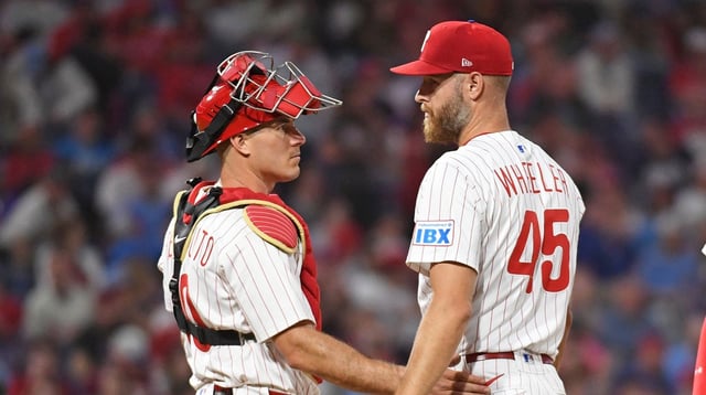 Apr 29, 2025; Philadelphia, Pennsylvania, USA; Philadelphia Phillies catcher J.T. Realmuto (10) talks with Philadelphia Phillies pitcher Zack Wheeler (45) against the Washington Nationals at Citizens Bank Park. Mandatory Credit: Eric Hartline-Imagn Images