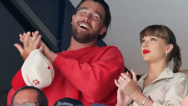 Travis Kelce, left, and Taylor Swift react as the Edmonton Oilers and the Florida Panthers play during the first period in Game Four of the 2025 Stanley Cup Final.