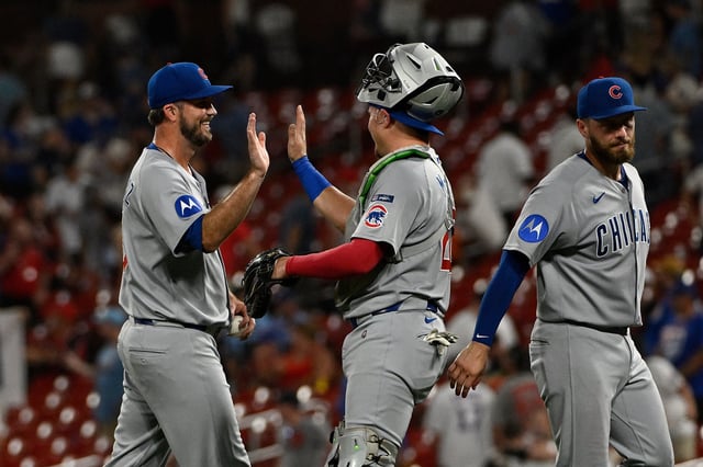 ST LOUIS, MISSOURI - AUGUST 9: Drew Pomeranz #45 and Reese McGuire #20 of the Chicago Cubs react after defeating the St. Louis Cardinals at Busch Stadium on August 9, 2025 in St Louis, Missouri.
