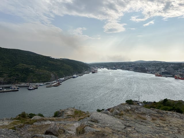 Smoke from a nearby wildfire is visible from Signal Hill, in St. John’s, N.L., on Monday, Aug. 11, 2025. THE CANADIAN PRESS/Sarah Smellie