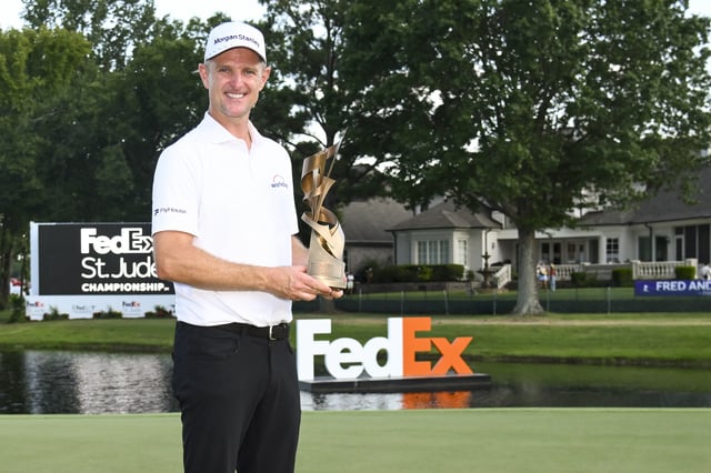 Aug 10, 2025; Memphis, Tennessee, USA; Justin Rose poses with the winner's trophy during the final round of the FedEx St. Jude Championship golf. Mandatory Credit: Steve Roberts-Imagn Images
