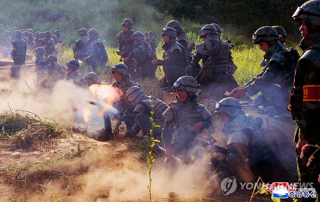 This photo, carried by North Korea's official Korean Central News Agency on Aug. 12, 2025, shows the North's artillery subunits of the Korean People's Army conducting a firing practice contest the previous day in a bid to bolster its war readiness posture. (For Use Only in the Republic of Korea. No Redistribution) (Yonhap)