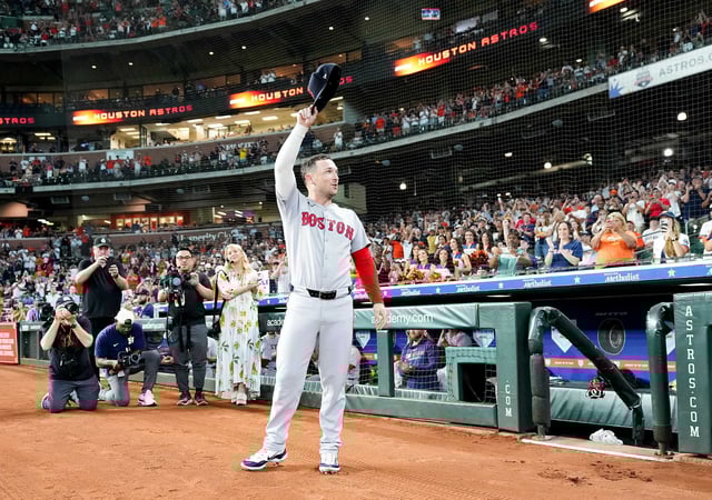 Boston Red Sox third base Alex Bregman (2) tips his hat after a highlight film was shown of his time with the Houston Astros before first pitch at Daikin Park in Houston on Monday, Aug. 11, 2025.