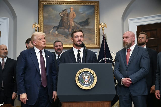 US President Donald Trump (2L) listens as US golfer Bryson DeChambeau speaks prior to signing an executive order restarting the Presidential Fitness Test in public schools in the Roosevelt Room of the White House in Washington, DC, on July 31, 2025.