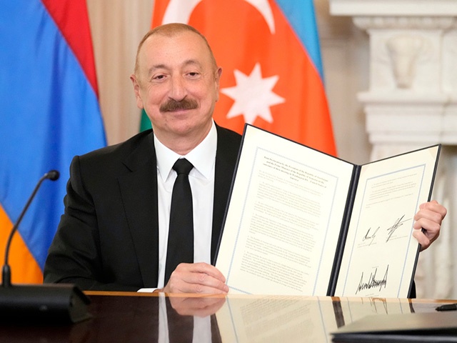 Title: US Armenia Azerbaijan Trump
Image ID: 25220771368573
Article:  Azerbaijan President Ilham Aliyev holds a signed trilateral agreement during a ceremony with Armenian Prime Minister Nikol Pashinyan and President Donald Trump in the State Dining Room of the White House, Friday, Aug. 8, 2025, in Washington. (AP Photo/Mark Schiefelbein)