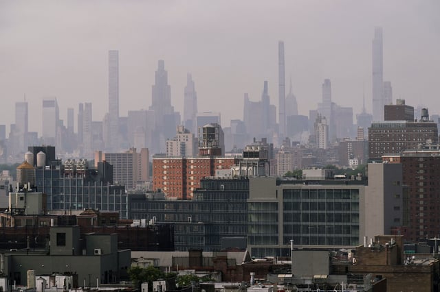 Cooling towers and air conditioning units are seen in the Harlem neighborhood amid a Legionnaires' disease outbreak in New York City, U.S., August 6, 2025. REUTERS/Adam Gray