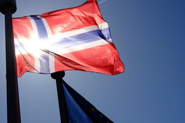 The Flag of Norway and the EU are seen in front of the Berlaymont, the EU Commission headquarter on April 7, 2025 in Brussels, Belgium.