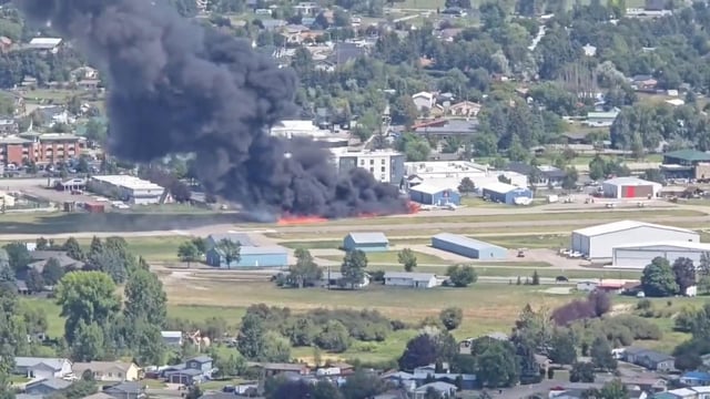 Smoke rises following a plane crash at Kalispell City Airport, in Kalispell, Montana, US, August 11. 
