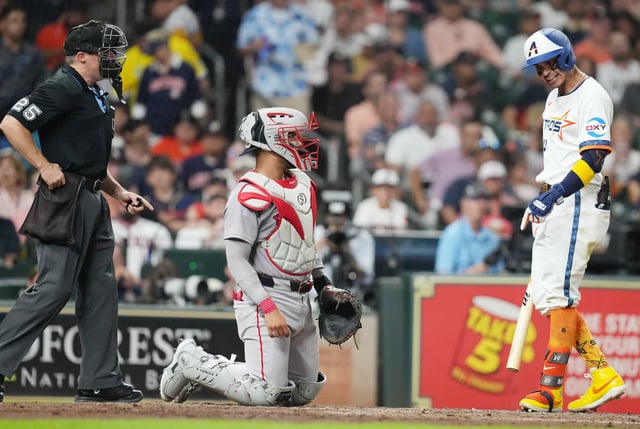 Houston Astros outfielder Mauricio Dubón (14) wanted a ball call in the bottom of the fourth inning against the Boston Red Sox at Daikin Park in Houston on Monday, Aug. 11, 2025.