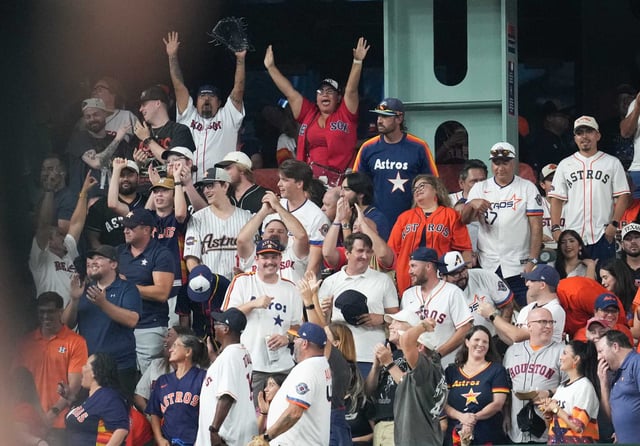 Fans react to Boston Red Sox third base Alex Bregman (2) two-run home run in the first inning at Daikin Park in Houston on Monday, Aug. 11, 2025.