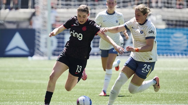 Aug 10, 2025; Portland, Oregon, USA; Portland Thorns FC midfielder Olivia Moultrie (13) controls the ball during the second half against Seattle Reign defender Shae Holmes (25) at Providence Park. Mandatory Credit: Troy Wayrynen-Imagn Images