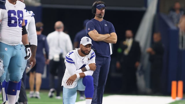 Aug 12, 2023; Arlington, Texas, USA; Dallas Cowboys quarterback Dak Prescott (4) and offensive coordinator Brian Schottenheimer watch a play in the game against the Jacksonville Jaguars at AT&amp;T Stadium. Mandatory Credit: Tim Heitman-Imagn Images