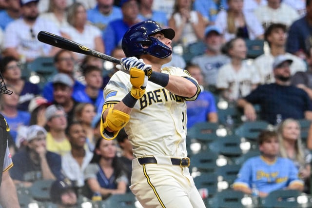 Aug 11, 2025; Milwaukee, Wisconsin, USA; Milwaukee Brewers designated hitter Christian Yelich (22) hits a solo home run in the third inning against the Pittsburgh Pirates at American Family Field. Mandatory Credit: Benny Sieu-Imagn Images