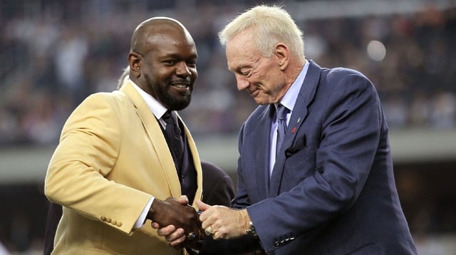 Nov 21, 2010; Arlington, TX, USA; Dallas Cowboys former running back Emmitt Smith (left) shakes owner Jerry Jones hand after being presented his hall of fame ring at halftime of the game against the Detroit Lions at Cowboys Stadium. Mandatory Credit: Matthew Emmons- Imagn Images