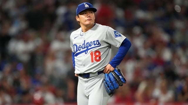 Aug 11, 2025; Anaheim, California, USA; Los Angeles Dodgers starting pitcher Yoshinobu Yamamoto (18) reacts after being removed in the fifth inning against the Los Angeles Angels at Angel Stadium. Mandatory Credit: Kirby Lee-Imagn Images