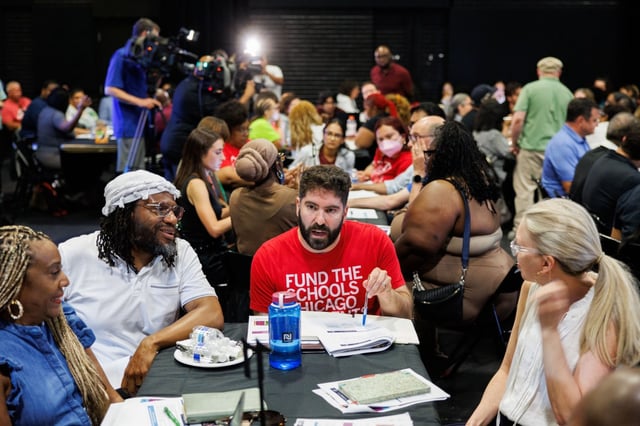 Chicago Teachers Union member Tom Felson, center, and others attend a community engagement session to discuss the Chicago Public Schools budget at Dyett High School on July 14, 2025.  (Armando L. Sanchez/Chicago Tribune)