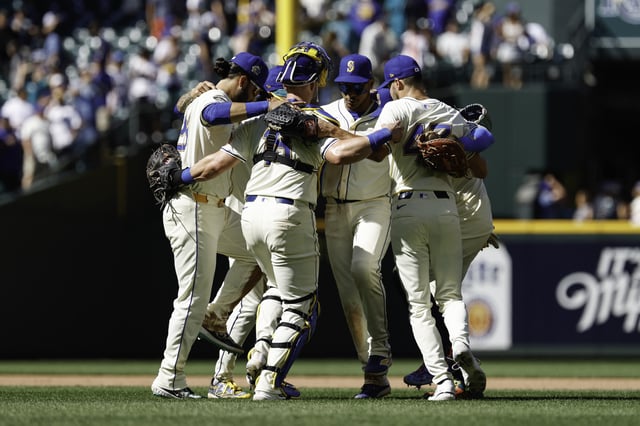 SEATTLE, WASHINGTON - AUGUST 10: Eugenio Suárez #28, Mitch Garver #18, Jorge Polanco #7 and Matt Brash #47 of the Seattle Mariners dance with teammates after the game against the Tampa Bay Rays at T-Mobile Park on August 10, 2025 in Seattle, Washington. The Seattle Mariners won 6-3.