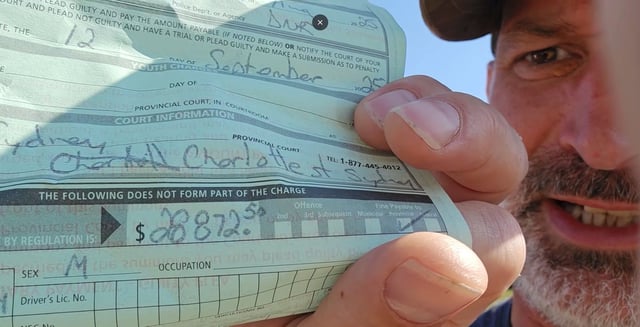  Jeffrey Evely shows the fine he received for walking in the woods after the Nova Scotia government banned any travel or activities in the woods due to extremely dry conditions.