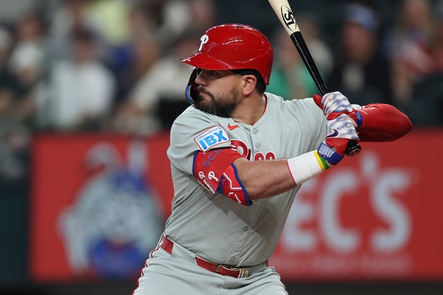 ARLINGTON, TEXAS - AUGUST 08: Kyle Schwarber #12 of the Philadelphia Phillies swings his bat during the first inning against the Texas Rangers at Globe Life Field on August 08, 2025 in Arlington, Texas.