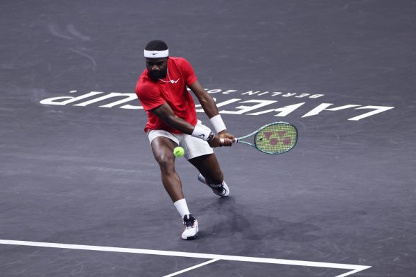 BERLIN, GERMANY - SEPTEMBER 21: Frances Tiafoe of Team World plays a backhand against Daniil Medvedev of Team Europe during the Men's Singles match on day two of Laver Cup at Uber Arena on September 21, 2024 in Berlin, Germany.  (Photo by Maja Hitij/Getty Images for Laver Cup)