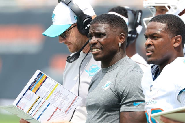 Dolphins receiver Tyreek Hill looks on from the sideline during Sunday’s prseason opener against the Bears at Soldier Field on Aug. 10, 2025 in Chicago, Illinois. (Photo by Justin Casterline/Getty Images)