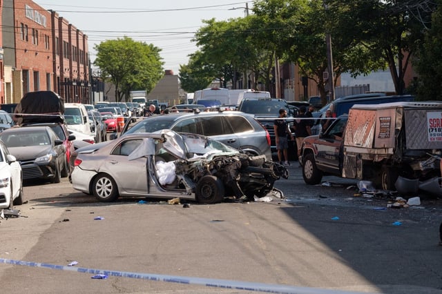 Police investigate a fatal car crash on 42nd St. near 19th Ave. in Queens, on Tuesday, Aug. 12, 2025. (Gardiner Anderson / New York Daily News)