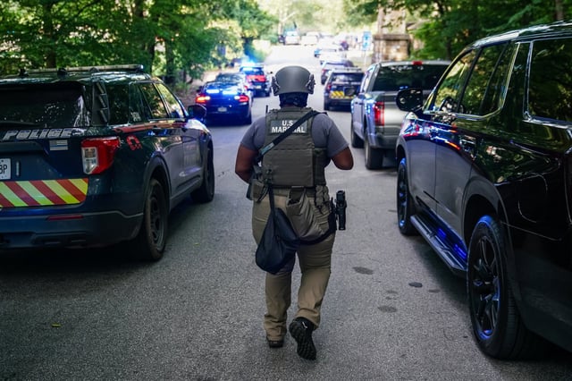 A U.S. Marshal near the CDC global headquarters during an active shooter incident, in Atlanta, on Aug. 8, 2025.