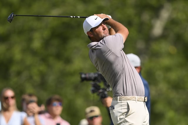 Aug 10, 2025; Memphis, Tennessee, USA; Scottie Scheffler plays his shot from the 18th tee during the final round of the FedEx St. Jude Championship golf. Mandatory Credit: Steve Roberts-Imagn Images/File Photo